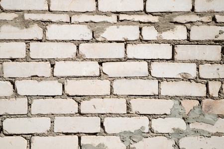 Texture of the wall for background. Roughness and irregularity. Building material brick