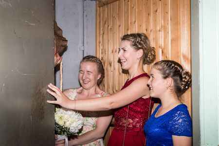 Kirov, Russia - July 27, 2018: Groom during the fun of the bride's ransom. One of the maint part of traditional Russian wedding ceremonyのeditorial素材