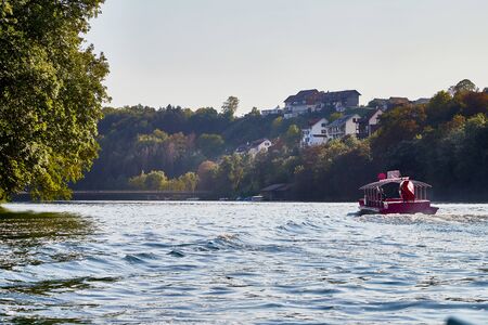 Rhine, Switzerland - September 19, 2018: Boat near the pier near the Rhine falls in Switzerland