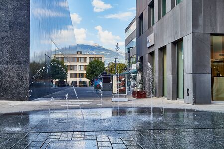 Vaduz, Liechtenstein - September 19, 2018: Fontain on the street in the old part of city Vaduz in a good dayのeditorial素材