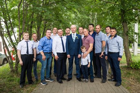 Kirov, Russia - July 27, 2018: Groom and his friends in the park. Male friends of groom during the...