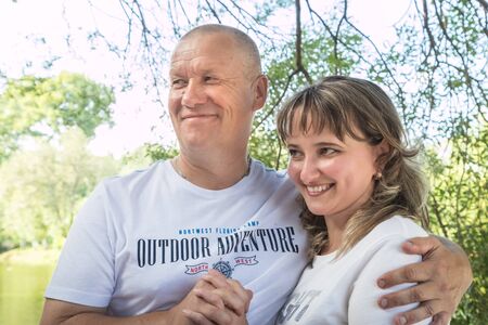 Kirov, Russia - August 21, 2018: Adult couple loving each other in the Park on a Sunny summer day....