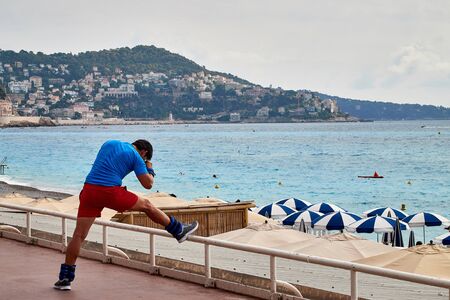 Nice, France - September 23, 2018: Promenade near the sea and sportsman on it in Nice in France in a good dayのeditorial素材
