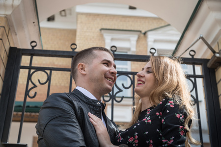 Portrait of young couple in love on the street in a summer day