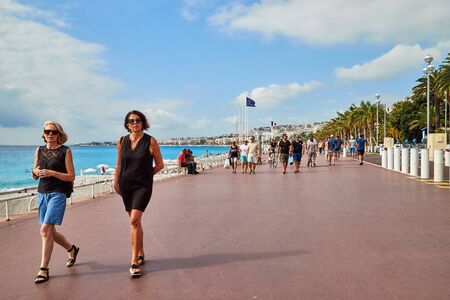 Nice, France - September 23, 2018: Promenade near the sea and the people on it in Nice in France in a good dayのeditorial素材