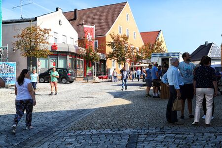 Trieste, Italy - September 25, 2018: People on the street of a small town during a national holiday in Germany in a good dayのeditorial素材