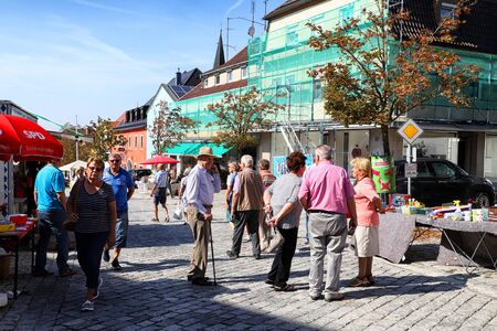 Trieste, Italy - September 25, 2018: People on the street of a small town during a national holiday in Germany in a good dayのeditorial素材
