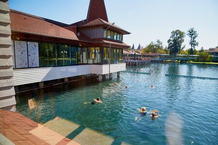 Heviz, Hungary - September 27, 2018: People on a warm water of therapeutic lake Heviz in Hungary in a sunny dayのeditorial素材