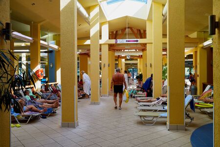 Heviz, Hungary - September 27, 2018: Hall and tourists inside the building on therapeutic lake Heviz in Hungary having hot water during all time of a yearのeditorial素材