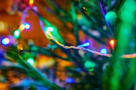 Christmas tree lights in night time. The photo is partially blurredの写真素材