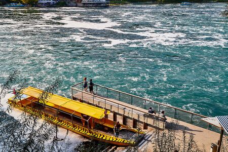 Rhine, Switzerland - September 19, 2018: Boat near the pier near the Rhine falls in Switzerlandのeditorial素材
