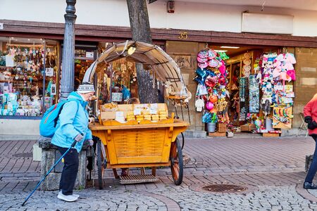 ZAKOPANE, POLAND - September 29, 2018: Carriage with cheese for sale on street for tourist walking and promenade in the city center in Zakopane in Polandのeditorial素材