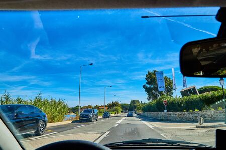 Nice, France - September, 22, 2018: View from car window of track near sea and blue sky in a sunny summer dayのeditorial素材