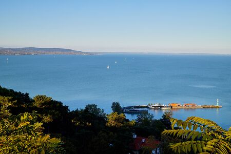 Tihany, Hungary - September 27, 2018: View of the Lake Balaton from Tihany on a sunny day. Ship on lake Balaton at sunsetのeditorial素材