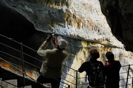 Skocjanske cave, Slovenia - September 26, 2018: Tourists on observation deck in Skocjanski reserve in the mountains. Person during travel looking on beautiful landscapeのeditorial素材
