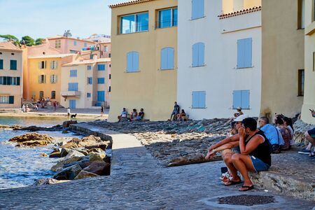 Saint-Tropez, France - September 22, 2018: Stony coast and embankment of elite city Saint-Tropez in a sunny summer dayのeditorial素材