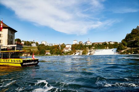 Rhine, Switzerland - September 19, 2018: The Rhine Falls in Switzerland. The largest waterfall in...
