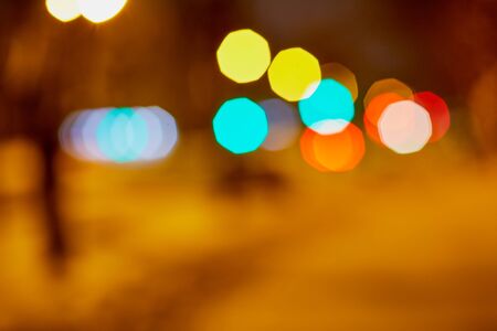 Abstract texture with light colored bokeh and black backgroundの写真素材