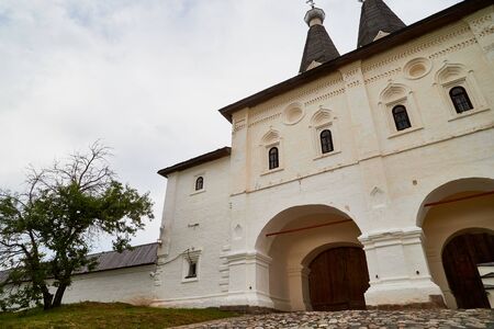 Entrance, wall and dome of Ferapontov monastery in a summer day in Ferapontovo in Russia