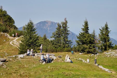 Rauschberghof, Germany - September 18, 2018: Path in the mountains among green plants on a summer day and tourist on it. Beautiful mountains landcapeのeditorial素材