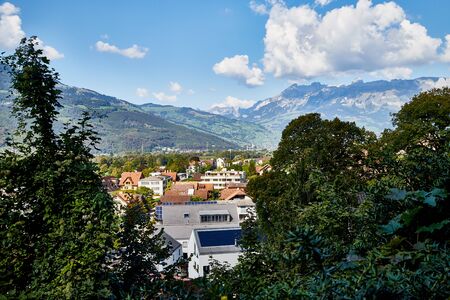Mountains and a view from the height of the valley with houses at the bottom of a Sunny summer day....