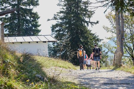 Rauschberghof, Germany - September 18, 2018: Path in the mountains among green plants on a summer day and tourist on it. Beautiful mountains landcapeのeditorial素材