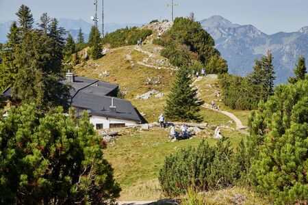 Rauschberghof, Germany - September 18, 2018: Path in the mountains among green plants on a summer day and tourist on it. Beautiful mountains landcapeのeditorial素材