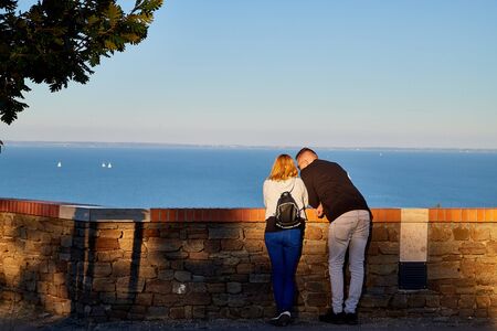 Tihany, Hungary - September 27, 2018: View of the Lake Balaton from Tihany on a sunny day. Tourists on the high shore of lake Balaton at sunsetのeditorial素材