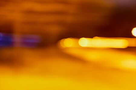 Abstract texture with blurred yellow background in night time