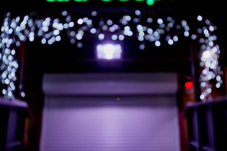 Abstract texture with light white bokeh and black background. Arch with lightの写真素材