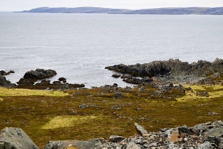 Norway landscape with beach of the Northern sea in cloudy weather in a summer, spring or autumn...