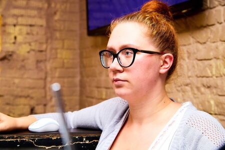 Kirov, Russia - September 17, 2019: Actress performing with microphone in small cafe or restaurant. Nice girlのeditorial素材