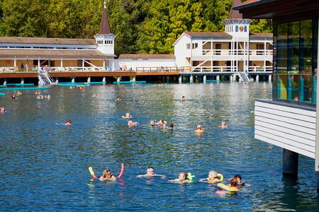 Heviz, Hungary - September 27, 2018: People on a warm water of therapeutic lake Heviz in Hungary in a sunny dayのeditorial素材
