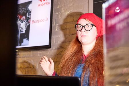 Kirov, Russia - October 10, 2019: Actress performing with microphone in small cafe or restaurant. Nice girlのeditorial素材
