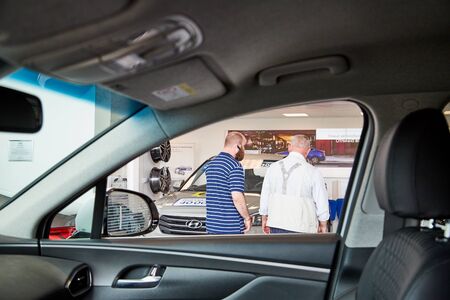 Petrozavodsk, Russia - June 21, 2019: Managers in showroom with cars of dealership Hyundai in Petrozavodsk city in Russiaのeditorial素材