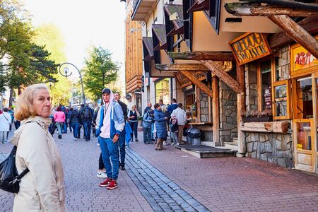 ZAKOPANE, POLAND - September 29, 2018: People on street for tourist walking and promenade in the city center in Zakopane in Polandのeditorial素材