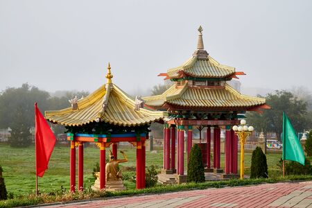 Elista, Russia - October 26, 2019: Gazebo in the form of a pagoda inside of the park near buddhist temple on a summer, spring or autumn day. Buddhism in Russia in Elistaのeditorial素材