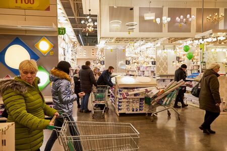 Kirov, Russia - November 23, 2019: Trading hall with goods and people in it in the store Leroy Merlin. Building materials, things for the house and buyers in the big shopのeditorial素材