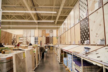 Kirov, Russia - November 23, 2019: Trading hall with goods and people in it in the store Leroy Merlin. Building materials, things for the house and buyers in the big shopのeditorial素材