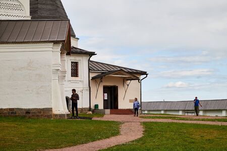 Ferapontovo, Russia - June 26, 2019: White stone Church, yard and people in Ferapontov monastery in...