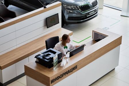 Petrozavodsk, Russia - June 19, 2019: Managers in showroom with cars of dealership Skoda in Petrozavodsk city in Russiaのeditorial素材