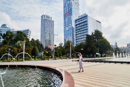 Batumi, Georgia - October 23, 2019: Part of city Batumi with houses, plant and blue sky with white clouds on a summer or autumn day in the country of Georgia, Adjaraのeditorial素材