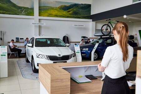 Petrozavodsk, Russia - June 19, 2019: Managers in showroom with cars of dealership Skoda in Petrozavodsk city in Russiaのeditorial素材