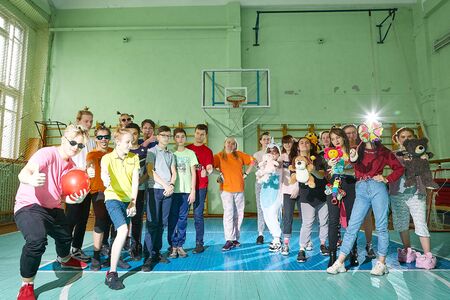 Kirov, Russia - September 28, 2019: Big group of student or schoolchildren in funny dress in gym....
