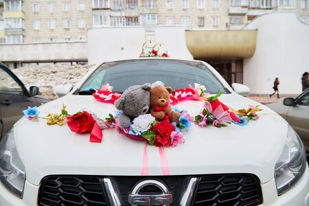 Kirov, Russia - March 22, 2019: Wedding decoration on the car with ribbons, flowers and toys before marriage ceremony in Russia in a dayのeditorial素材