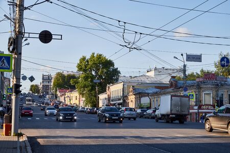 Kirov, Russia - July 16, 2019: Street with cars in provincial city Kirov on a sunny summer day. Road...