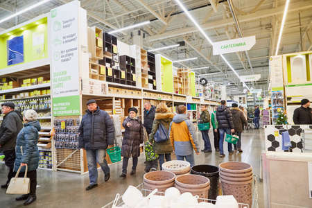 Kirov, Russia - November 23, 2019: Trading hall with goods and people in it in the store Leroy Merlin. Building materials, things for the house and buyers in the big shopのeditorial素材