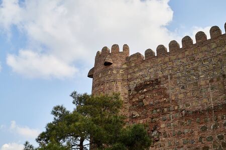 Ancient ruins of fortress on a high mountain and blue sky background in a nice day