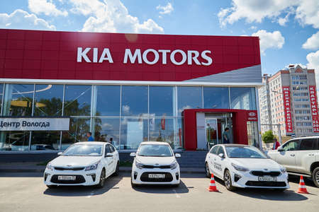 Vologda, Russia - June 18, 2019: Entrance in showroom with car of dealership KIA in Vologda city in Russiaのeditorial素材