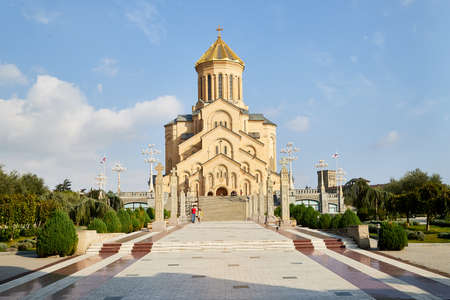 Tbilisi, Georgia - October 21, 2019: Big orthodox cathedral St. Trinity or Chirch Sameba in Tbilisi city in Georgia and blue sky with white clouds backgroundのeditorial素材